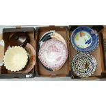 A collection of assorted pottery to include bowls, chargers, platters etc