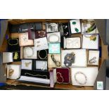 A mixed collection of cased costume jewellery to include bracelets, earrings, brooches, etc.