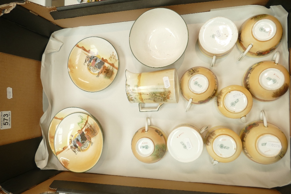 A collection of Royal Doulton tea ware in the Coaching Scenes design to include 9 cups, Milk jug,