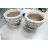 Large matching pair of stone garden planters with floral designs (2)