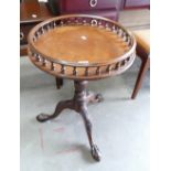 Edwardian style circular tripod side table with ball and claw feet and a gallery