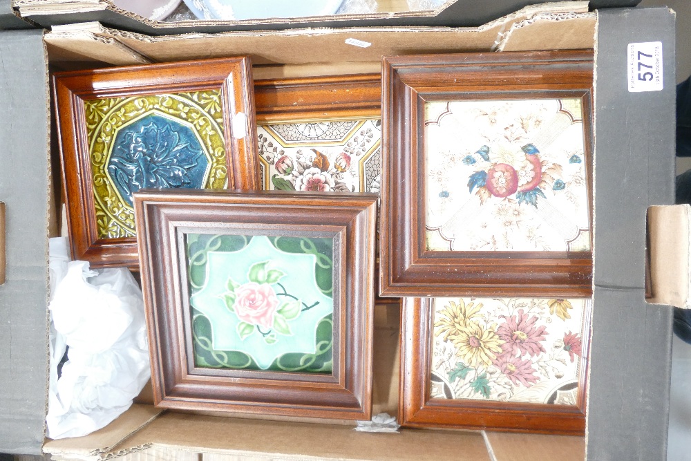 A collection of framed tiles including a triple tile panel and four single vintage tiles,