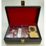 A jewellery box containing various items including silver scottie dog brooch, silver pendant,