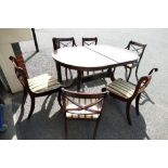 Mahogany extending dining table and six matching chairs including carvers(7)