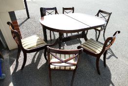 Mahogany extending dining table and six matching chairs including carvers(7)