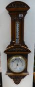 A heavily carved Edwardian Aneroid Barometer (unnamed).