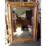 Large gilt framed bevel edged wall mirror