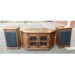 20th Century oak 2 door leaded glazed TV unit with canted sides,