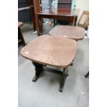 A pair of 20th Century arts and craft oak hand beaten brass topped circular pub/coffee tables (2)