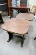A pair of 20th Century arts and craft oak hand beaten brass topped circular pub/coffee tables (2)