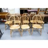 A set of 8 ash and elm Windsor dining chairs with crinoline stretchers,