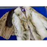 Two synthetic fur jackets together with a similar mink stole and matching hat.