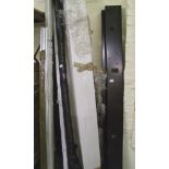 A mixed collection of lengthy items including plastic trim and metal shelving etc.