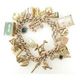 9ct Rose Gold bracelet with 25 various 9ct gold charms, 49.