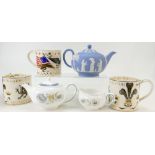 A collection of Wedgwood pottery including Jasperware teapot, Richard Guyatt commemorative mugs,