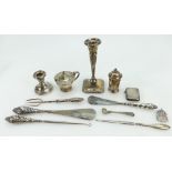A collection of vintage silver items including candlesticks, mustard pot & cover, matchbox,