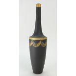 A prestige Wedgwood Black & Gold Festoon Jasper Bottle Shaped Vase. Boxed. 30 cm in height.