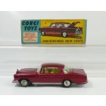 Corgi 253 Dark Red Mercedes Benz 220 SE Coupe in good condition and in original near good condition