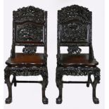 A pair of Chinese hardwood carved chairs,