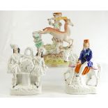 Three Staffordshire figures, Havelock on Horse, spill vase and clock figure. 22 - 29.5 cm (3).
