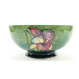 Walter Moorcroft large footed fruit bowl decorated in the Orchid design, diameter 23.