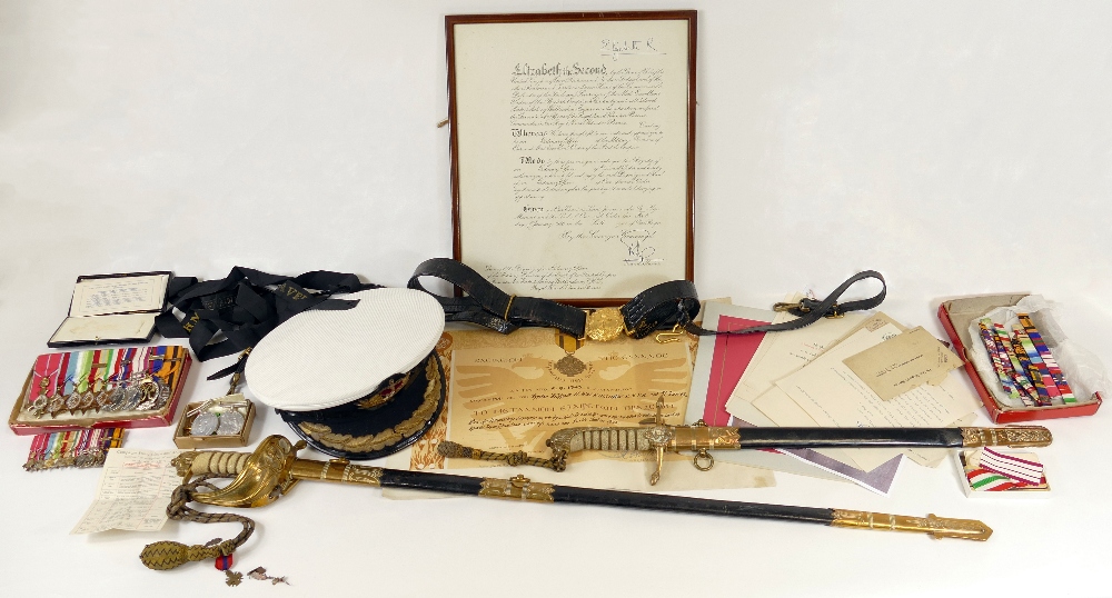 A group of interesting medals, swords and other items relating to Commander Herbert.