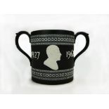 Wedgwood black Jasperware two handled loving cup presented to Norman Wilson on his retirement