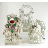 Three large Staffordshire figures - 2 arbour groups and watch holder, 26 - 33.