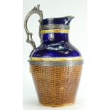 19th century Majolica jug with metal fittings decorated as a woven basket, height 23cm.
