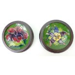 Two MOORCROFT dishes in frames, Hibiscus & Clematis pattern, each dish 12cm wide, excl.