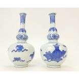 Pair of Chinese blue & white vases 18cm high.