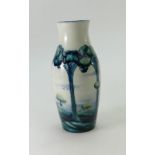 William Moorcroft Macintyre vase in a rare landscape design on white ground, height 18.