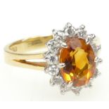 Orange coloured real gemstone ring - possibly orange Sapphire - size M weight 4.6g. 18ct gold.