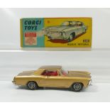 Corgi 245 Gold Buick Riviera in near mint condition and in original good to excellent condition box.