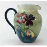 Walter Moorcroft jug in Spring Flowers design 16.5cm high.