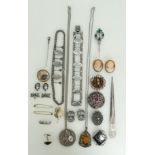 A collection of costume jewellery including brooches, pendants, necklaces, some silver items noted.