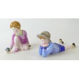 Two group Crown Staffordshire figurines one of a girl kneeling together with a boy lying down,