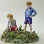 A Crown Staffordshire large figure group of a girl picking flowers and boy standing,