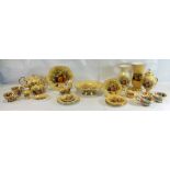A large collection of Aynsley Orchard Gold china items including tea set, mugs, lidded jars, vases,