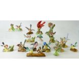 A collection of Crown Staffordshire small birds on stumps by J T Jones and nine others on logs also