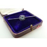 15ct Gold and Aquamarine Brooch, 64mm wide, white gold facing to setting 14.9g gross.