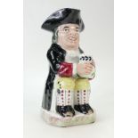 Early 19th Century Staffordshire Toby Jug 25cm high. Damage to feet and hat.