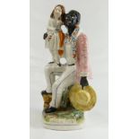 Uncle Tom Staffordshire figure, earlier figure, man with girl on knee 27cm.