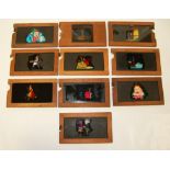 Ten mahogany framed mechanical slides - various fantasy subjects.
