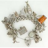 Silver Charm Bracelet with large number of silver charms. 131.