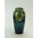 William Moorcroft 1920s vase decorated with the unusual two tone blue & green leaf and berries