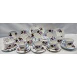 A Shelley Floral tea service comprising - seven cups and saucers, side plates, milk jug,
