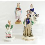 Four Staffordshire figures, one bearing old trade label of Oliver Sutton,
