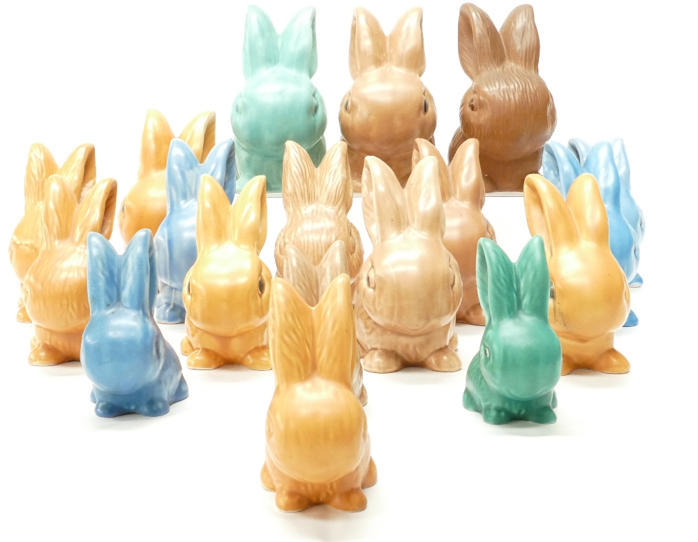 A good collection of Wadeheath models of seated rabbits in various sizes and colours including blue,