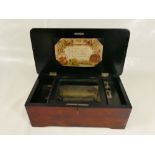 Musical Box playing 4 tunes / airs in stained wooden case measuring 35.5 cm wide.